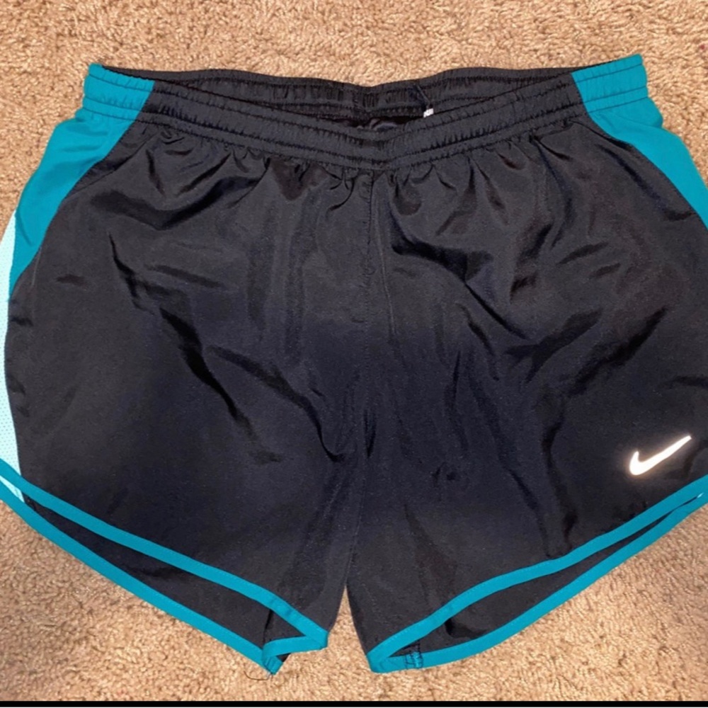 Woman’s Nike athletic shorts in a size small. dri-fit. Nice. Smoke free home.